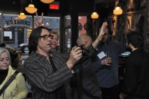 1. Guy Rodgers photographing guests at ELAN-QWF schmoozer (La Drinkerie)