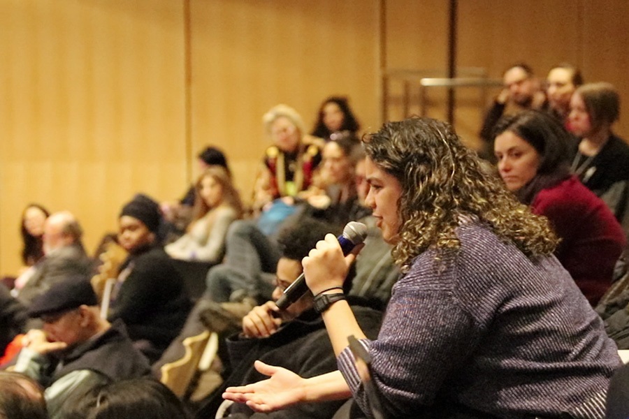 Audience member asking a question in a microphone